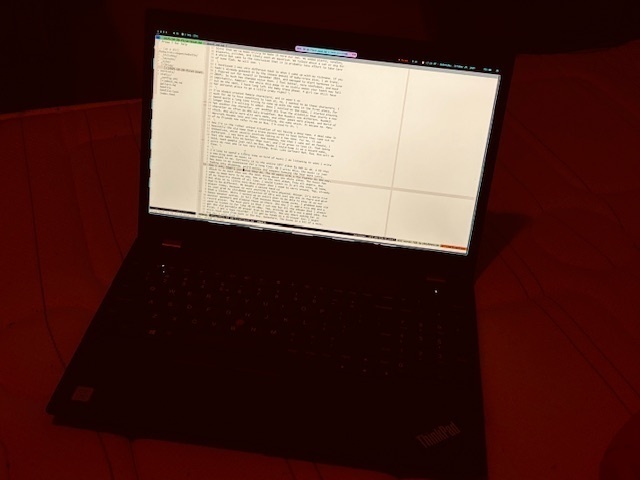 A thinkpad laptop showing a Vim text editor, with the current blog post on the screen.